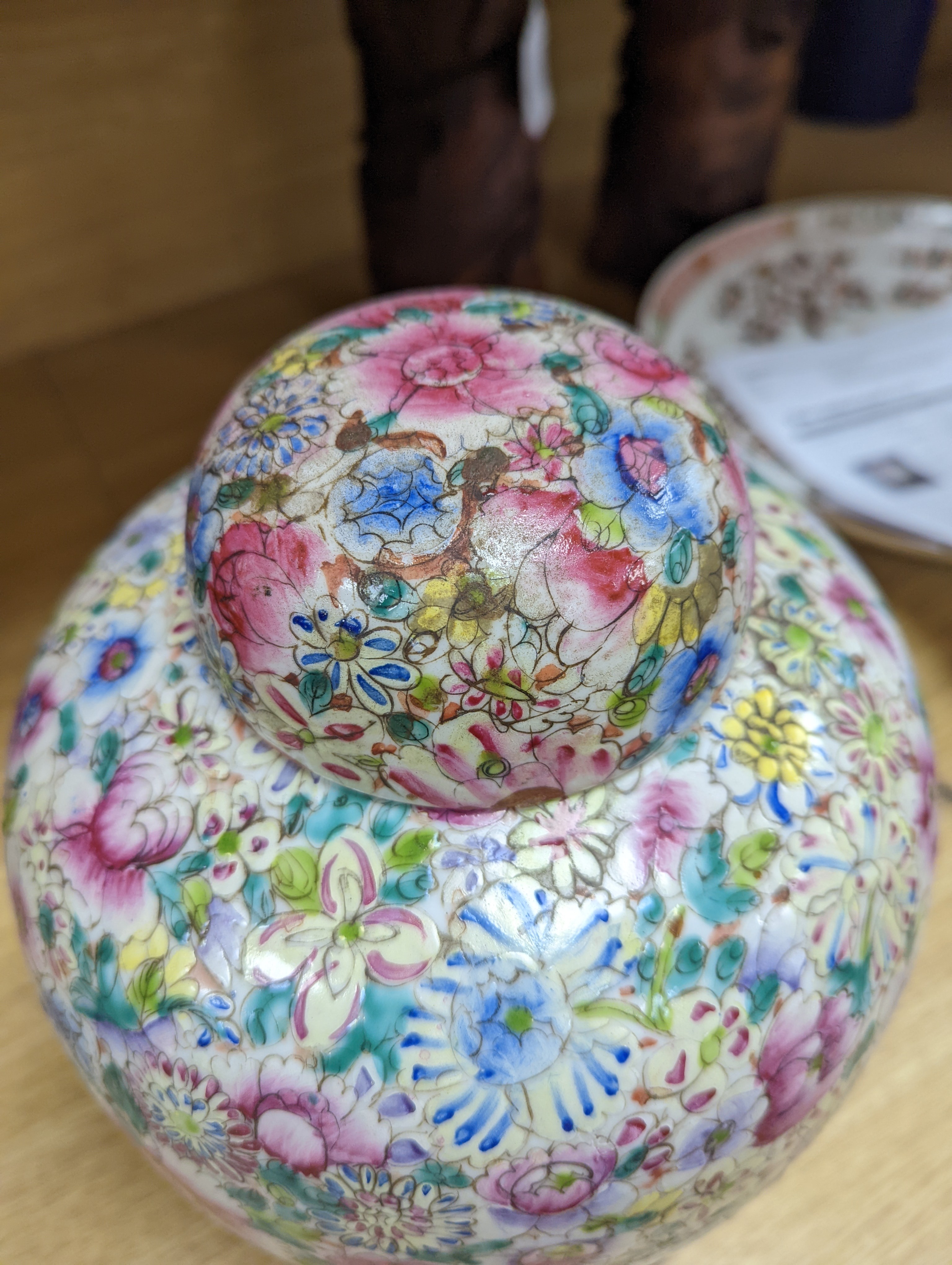A Chinese thousand flower famille rose jar and cover, early 20th century, wood stand 28cm